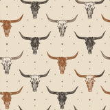 Cattletrail constellation wallpaper with brown steer skull pattern over a beige background.