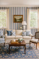 Blue and white striped Blueberry Grainstripe Wallpaper from York Wallcoverings, seen in a traditional living room setting.