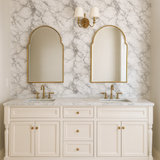 Carrara Veil wallpaper featuring marble pattern and neutral tones, covering the bathroom wall.