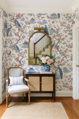 Peacock Pavilion wallpaper with blue and red toile pattern, featuring peacocks, pagodas, and floral branches.
