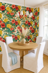 Floral Island Hibiscus Wallpaper with red and yellow flowers and green leaves, styled in a dining room.
