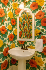 Floral Island Hibiscus Wallpaper with orange and yellow hibiscus pattern.
