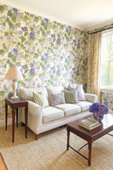 Floral Ivy & Amethyst Wallpaper with purple and green flowers, covering the entire room.
