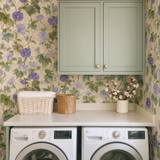 Ivy and amethyst wallpaper with floral pattern and green leaves on a neutral background.