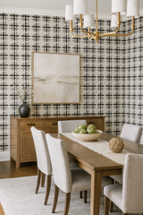 Inkwoven Grid Wallpaper with black and gray pattern against a light beige background.