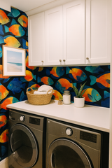 Tropic Chorus Wallpaper with vibrant fish pattern on a black backdrop.