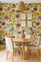 Floral print Prairie Reverie Wallpaper featuring a pattern of sunflowers and purple flowers on a cream background.
