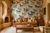 Horse-patterned Run Wild Wallpaper with running horse illustrations, covering the wall of a Southwestern-styled living room.
