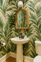 Green leaf pattern wallpaper with natural accents.