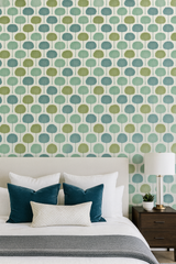 Patterned palmetto wallpaper by Brewster featuring green, teal, and white tones in a bedroom setting.