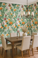 Prickly pear paintings wallpaper with cactus and flower pattern, covering the wall in a dining room.
