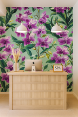 Floral wallpaper with purple orchid pattern on a light green background.