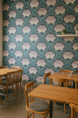Tea Garden Talisman Wallpaper with lotus pattern on a blue background.

