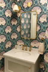 Floral pattern wallpaper with lotus design from Tea Garden, adorning a vintage-style bathroom.
