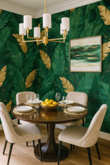 Jungle Luxe wallpaper featuring green and gold tropical leaves.
