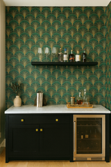 Green and gold fan patterned wallpaper with Art Deco design, against a bar with wine storage.

