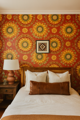 Sunburst Sonata Wallpaper with sunflower pattern on a red background.
