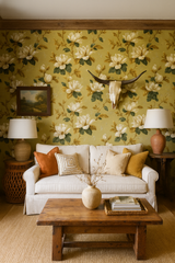 Magnolia Moonlight wallpaper with floral pattern and green and cream tones, styled with rustic wooden furniture.
