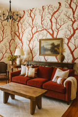 Manzanita tangle wallpaper featuring a red tree branch pattern on a cream background.
