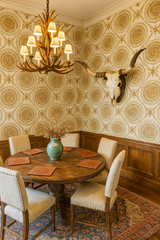 Gilded medallion pattern wallpaper featuring golden circular designs and intricate detailing.