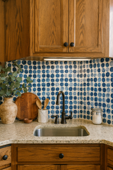 Bubbled Ink Wallpaper with blue dot pattern on off-white, textured background.