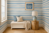 Faded stroke wallpaper with blue and beige hues, featuring a painted pattern on the walls.
