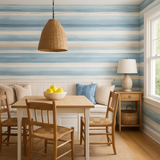 Faded stroke wallpaper with horizontal stripes in light blue and cream shades, evoking a coastal style.
