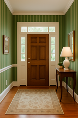 Green and white striped Clubhouse Stripe Wallpaper by York Wallcoverings with a vertical pattern and classic style.
