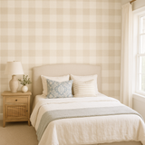 Beige check wallpaper by Seabrook Wallcoverings, covering the wall in a bedroom setting.
