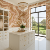 Rosé marble wallpaper with gold accents, featuring a swirling pattern and textured finish.
