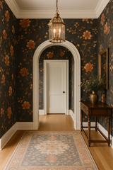 Rusted Bloom Wallpaper with floral pattern on a dark background.