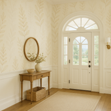 Sand fern wallpaper with leaf pattern, covering a wall in an entryway.