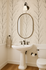 Winter Branch wallpaper with a tree branch pattern, neutral tones covering the walls in a stylish bathroom.