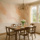 Desert Ribbon Wallpaper with peach ribbons and gold linework, in a dining room setting.
