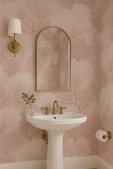 Blush coral forest wallpaper with a tree branch pattern.
