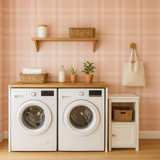 Blush plaid wallpaper with light and dark pink squares, behind a laundry setting with appliances.