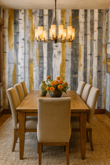 Birch and brass wallpaper with vertical stripes of gold, gray, and white.