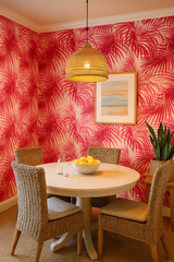 Tropical-themed wallpaper with a red palm leaf pattern on a beige background.
