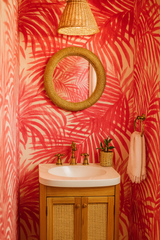 Flamingo Mirage wallpaper with red palm frond pattern on a cream background.
