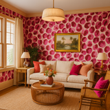 Rose Ember Wallpaper with pink watercolor pattern, displayed in a coordinated living room.

