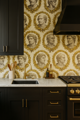 Laurel Imperium Wallpaper with classical head pattern on an off-white textured background.
