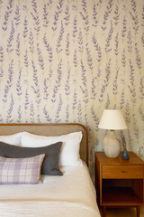 Lavender reverie wallpaper featuring purple floral sprigs, textured background.
