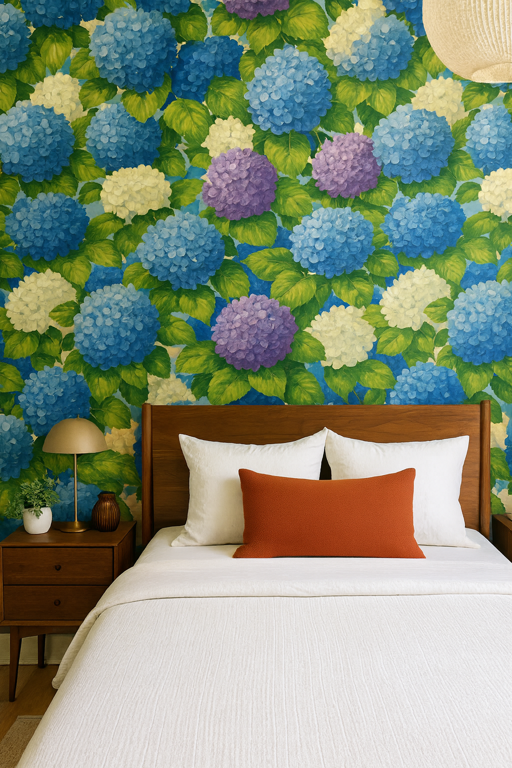 Hydrangea Jubilee wallpaper with blue, white, and purple flowers, with green leaves covering the wall.

