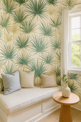Yucca Mirage wallpaper with green palm leaf pattern on a cream background.
