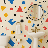 Geometric scatter pop wallpaper with colorful shapes on a beige background.