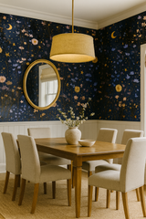 Floral Meadow Magic Wallpaper with moon and star accents, decorating a room.
