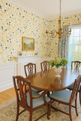 Floral Cornflower Parade Wallpaper with blue and yellow flowers on an off-white background.