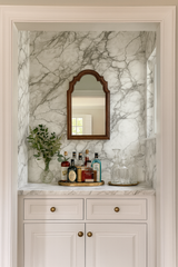 Carrara Veil Wallpaper featuring marble pattern from wallpaper installation in a styled bar area.
