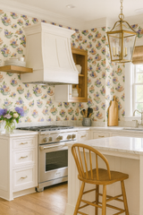 Floral teacup garden wallpaper with teacups and flowers, on the kitchen wall.

