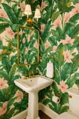 Tropical floral wallpaper with palm leaves and pink flowers, patterned background.
